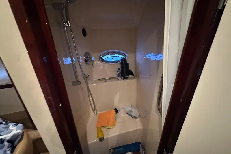 Yacht Photos Pics Shower area in 2010 Sea Ray 390 Sundancer yacht with porthole window.