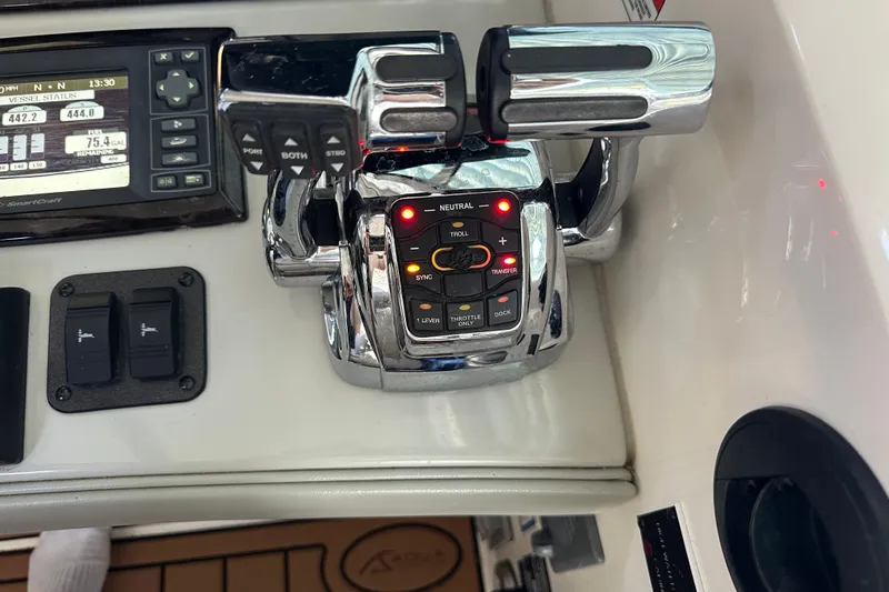  Yacht Photos Pics Control panel of a 2010 Sea Ray 390 Sundancer boat with throttle and display.