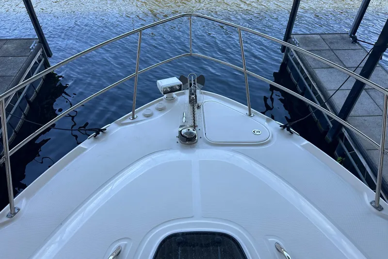  Yacht Photos Pics Bow view of 2010 Sea Ray 390 Sundancer docked at marina.