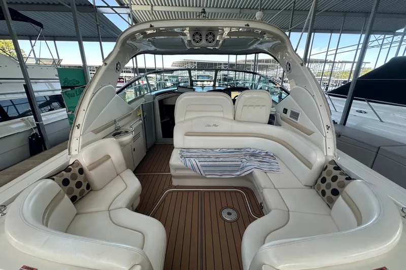  Yacht Photos Pics 2010 Sea Ray 390 Sundancer interior with white seating and wood flooring.