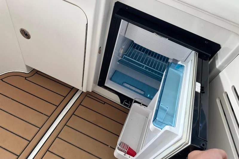  Yacht Photos Pics Open mini fridge on 2010 Sea Ray 390 Sundancer boat with teak flooring.