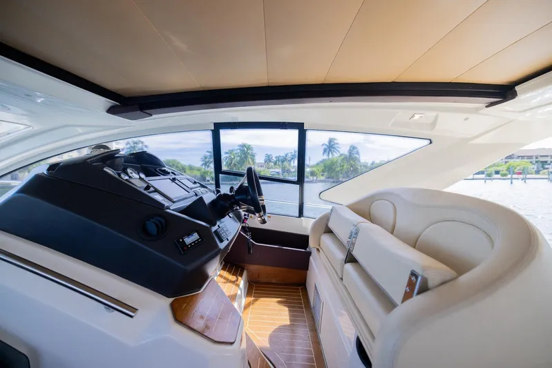 She's Royal Yacht Photos Pics Interior of 2014 Cranchi M 44 HT yacht, featuring helm and seating area with scenic view.