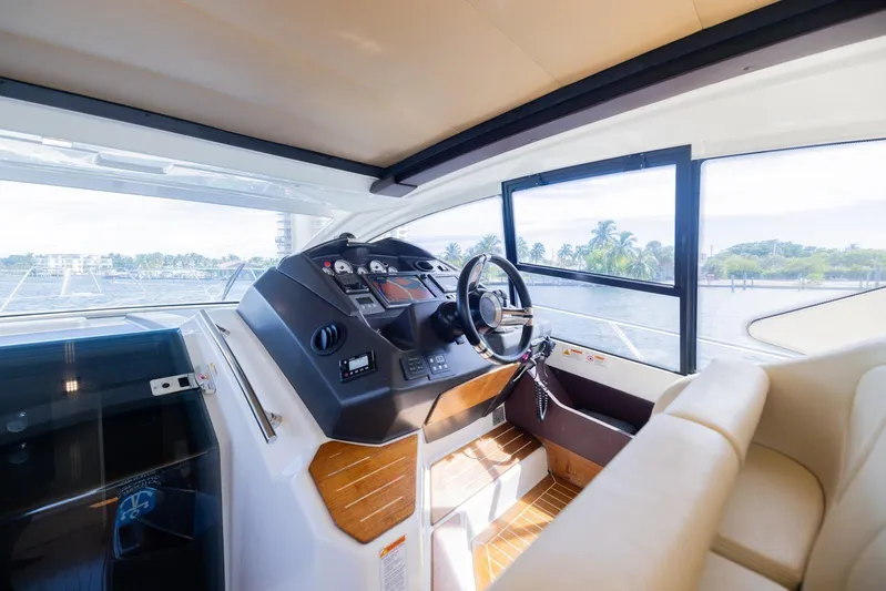 She's Royal Yacht Photos Pics Interior helm of 2014 Cranchi M 44 HT yacht with modern controls and panoramic view.