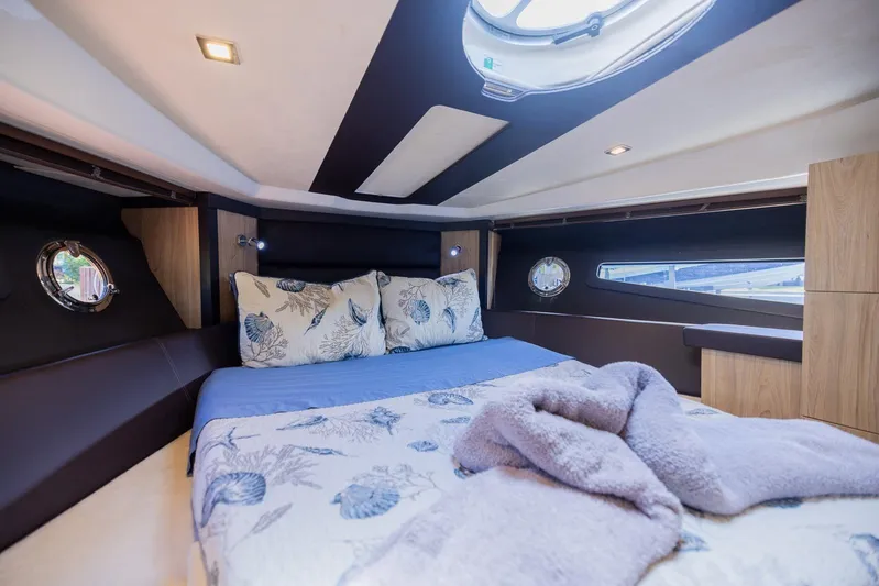 She's Royal Yacht Photos Pics Luxurious cabin interior of 2014 Cranchi M 44 HT yacht with cozy bedding.