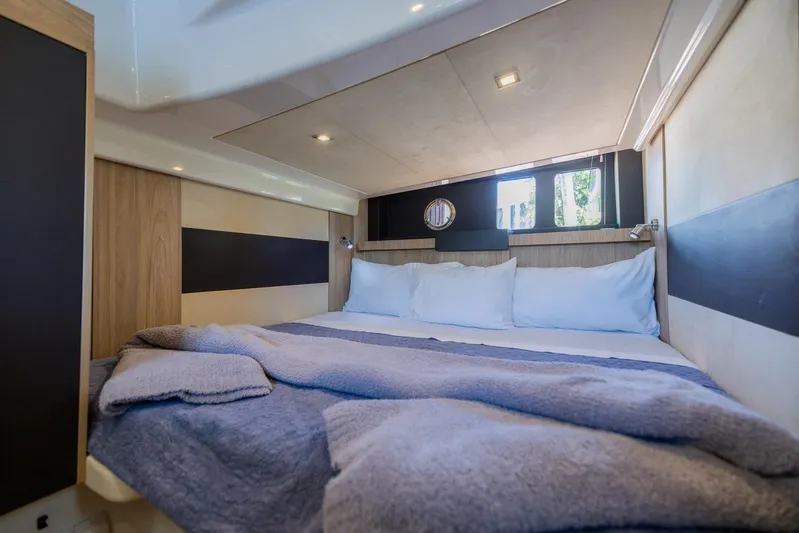 She's Royal Yacht Photos Pics Luxurious cabin interior of 2014 Cranchi M 44 HT yacht with cozy bedding.