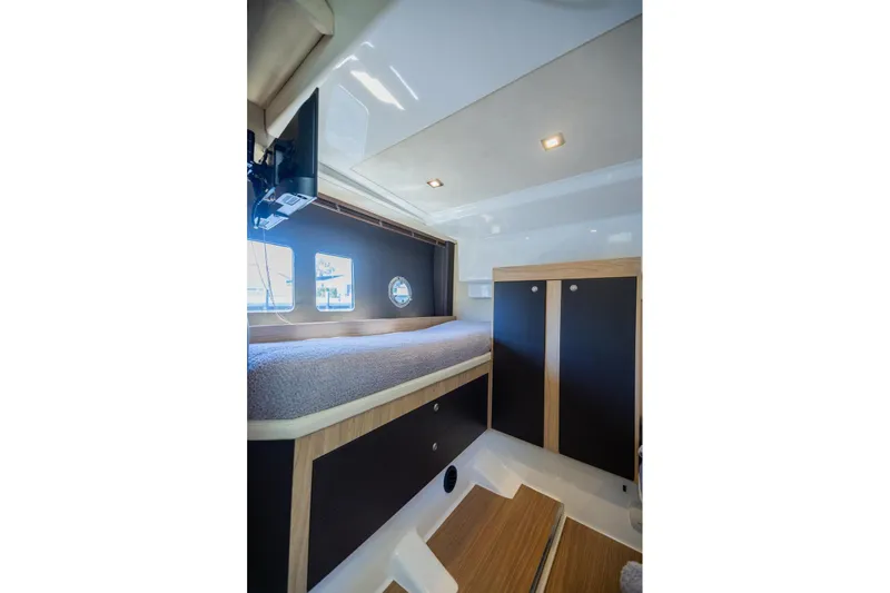 She's Royal Yacht Photos Pics Interior cabin of 2014 Cranchi M 44 HT yacht with bed and storage.