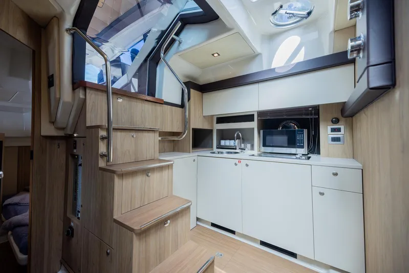 She's Royal Yacht Photos Pics Luxurious 2014 Cranchi M 44 HT yacht interior with modern kitchen and wooden stairs.