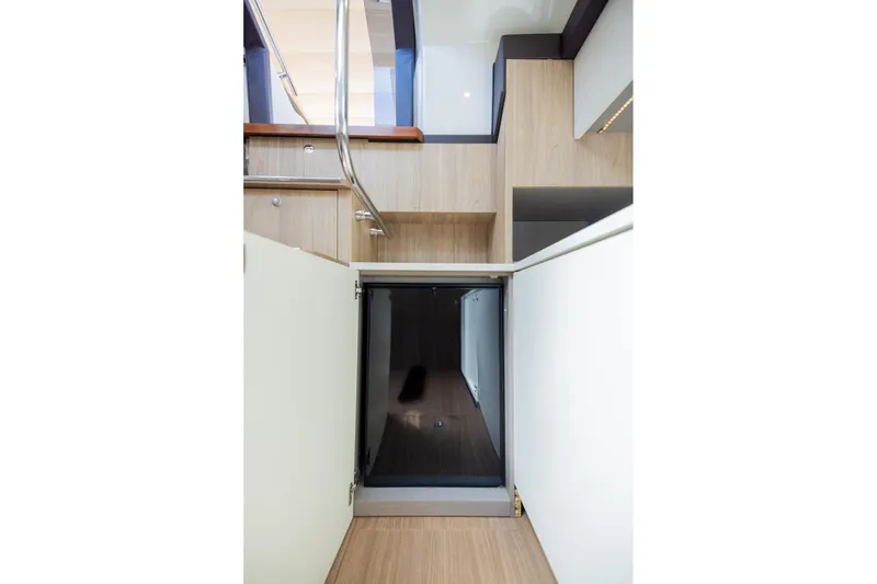 She's Royal Yacht Photos Pics Interior view of 2014 Cranchi M 44 HT yacht, featuring modern wooden stairs and sleek design.