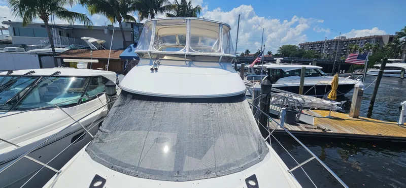  Yacht Photos Pics 2013 Meridian 391 Sedan yacht docked at a marina under a clear blue sky.