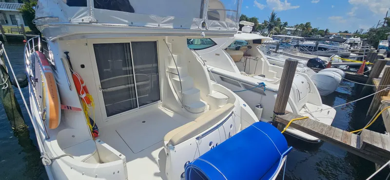  Yacht Photos Pics 2013 Meridian 391 Sedan docked at marina, featuring spacious deck and modern design.