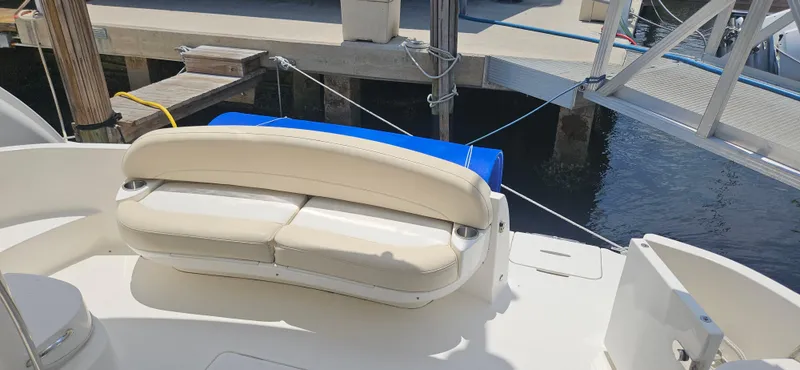  Yacht Photos Pics 2013 Meridian 391 Sedan boat with white seating at dock.