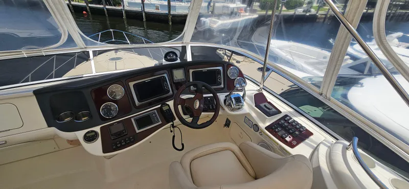  Yacht Photos Pics 2013 Meridian 391 Sedan helm with modern navigation equipment and comfortable seating.