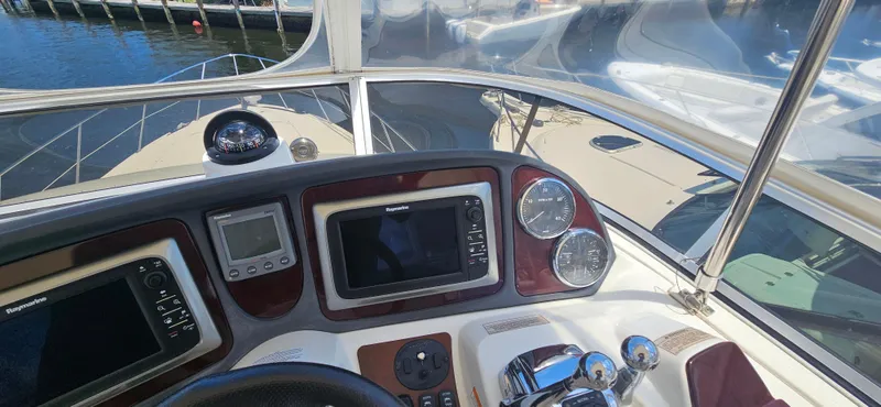  Yacht Photos Pics 2013 Meridian 391 Sedan helm with navigation instruments and controls at marina.