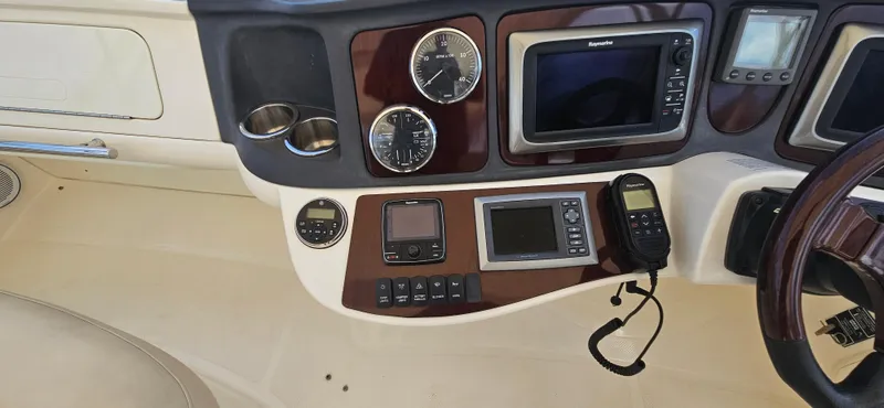  Yacht Photos Pics Control panel of a 2013 Meridian 391 Sedan yacht with navigation instruments and gauges.