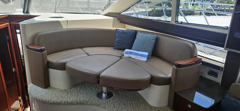  Yacht Photos Pics Luxurious seating area in 2013 Meridian 391 Sedan yacht interior.