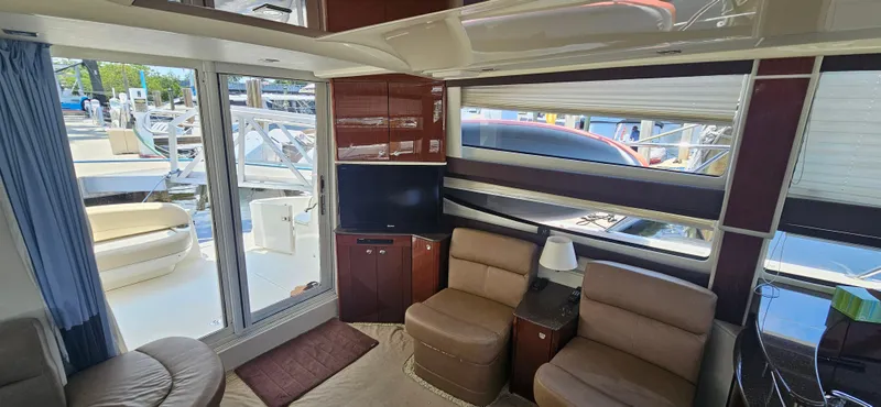  Yacht Photos Pics Luxurious interior of 2013 Meridian 391 Sedan yacht with comfortable seating and modern decor.