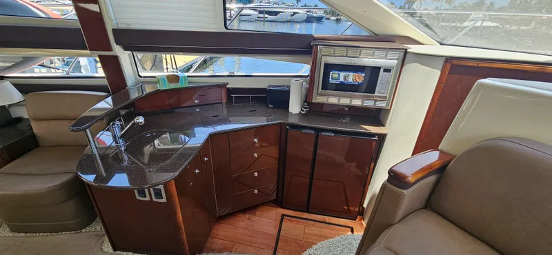  Yacht Photos Pics Luxurious interior of a 2013 Meridian 391 Sedan yacht with modern amenities.