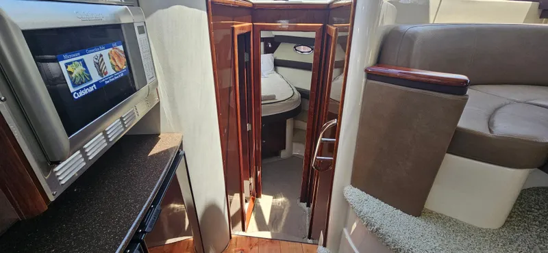  Yacht Photos Pics Interior of 2013 Meridian 391 Sedan yacht with kitchen and cabin view.