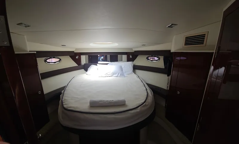 Yacht Photos Pics Luxurious cabin interior of 2013 Meridian 391 Sedan yacht with cozy bed and elegant design.
