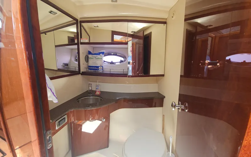  Yacht Photos Pics Bathroom interior of 2013 Meridian 391 Sedan yacht with sink and mirror.