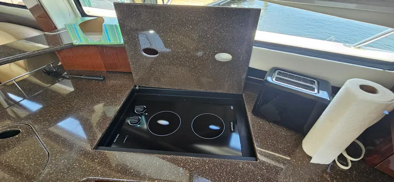  Yacht Photos Pics 2013 Meridian 391 Sedan yacht kitchen with stovetop, toaster, and paper towel holder.