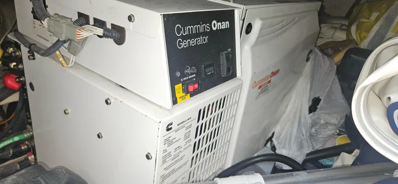  Yacht Photos Pics Cummins Onan generator inside a 2013 Meridian 391 Sedan boat engine compartment.