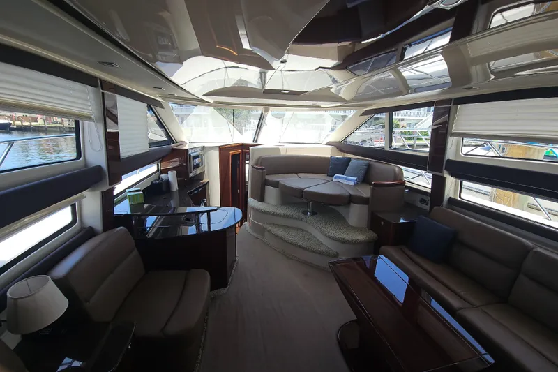  Yacht Photos Pics Luxurious interior of a 2013 Meridian 391 Sedan yacht with elegant seating and panoramic windows.