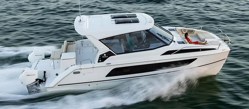  Yacht Photos Pics 2022 Aquila 36 Sport cruising on open water, showcasing sleek design and performance.