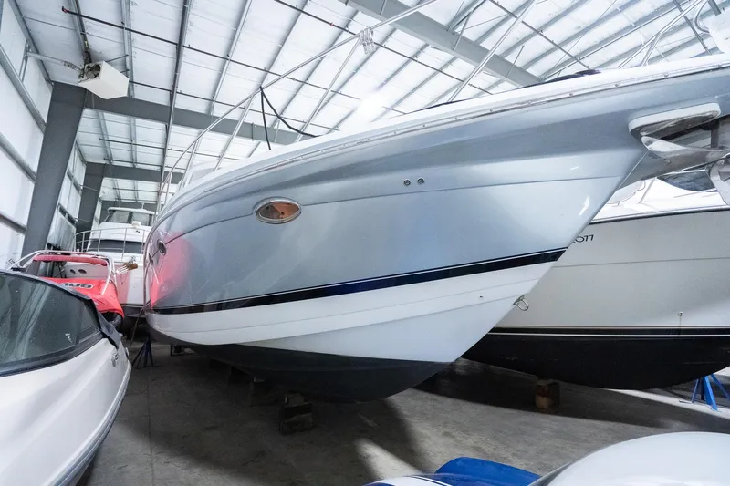 This Is Dope Yacht Photos Pics 2005 Formula 40 Cruiser boat in storage, side view, indoor facility.