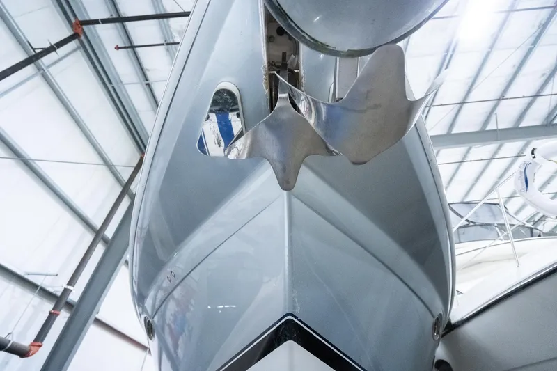 This Is Dope Yacht Photos Pics 2005 Formula 40 Cruiser yacht bow in a storage facility, showcasing sleek design and anchor.