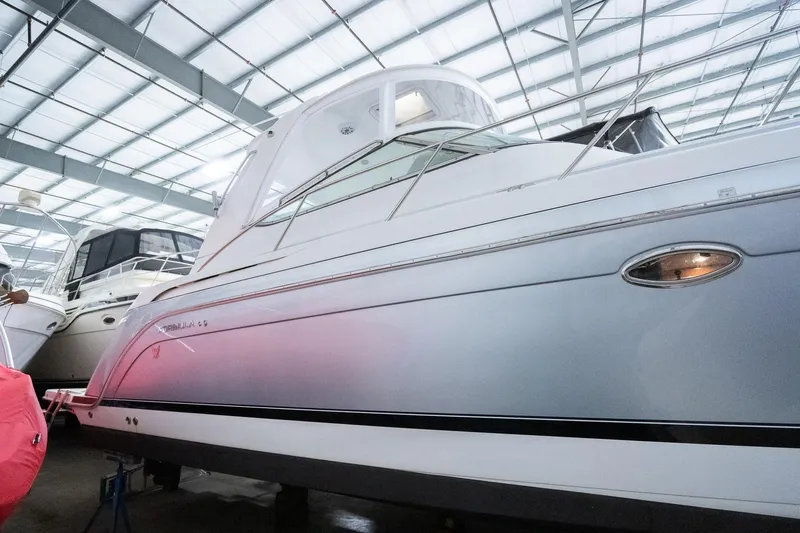 This Is Dope Yacht Photos Pics 2005 Formula 40 Cruiser yacht in a marina, under a metal roof.