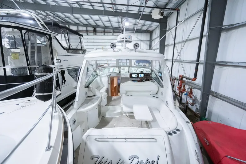 This Is Dope Yacht Photos Pics 2005 Formula 40 Cruiser yacht in a storage facility, showcasing sleek design and spacious interior.