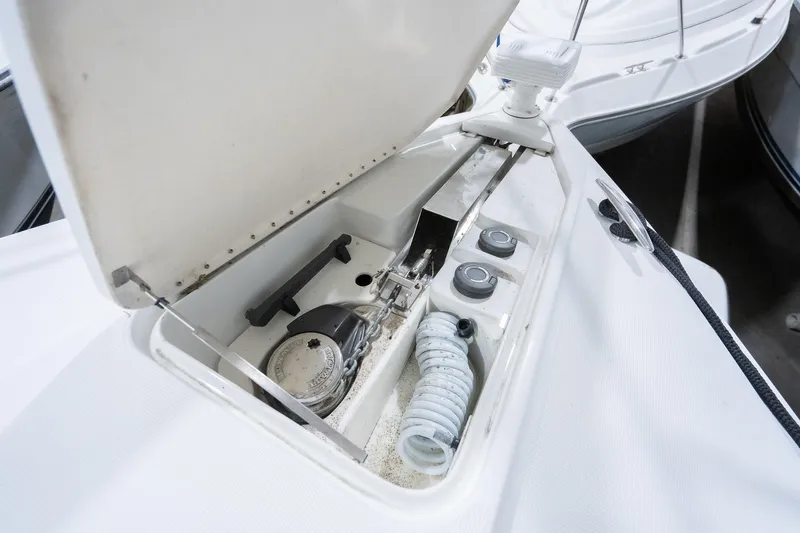 This Is Dope Yacht Photos Pics 2005 Formula 40 Cruiser deck storage compartment with coiled hose and equipment.