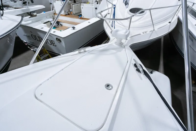 This Is Dope Yacht Photos Pics 2005 Formula 40 Cruiser boat deck, white finish, docked among other vessels.