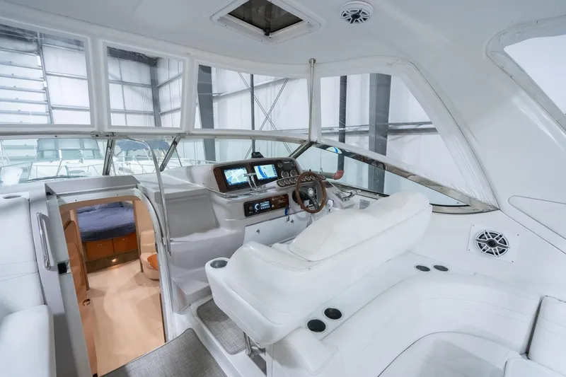 This Is Dope Yacht Photos Pics 2005 Formula 40 Cruiser interior with helm, navigation screens, and cabin entrance.
