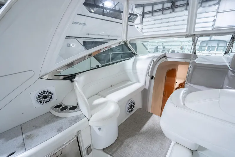 This Is Dope Yacht Photos Pics 2005 Formula 40 Cruiser interior with white seating and modern design.