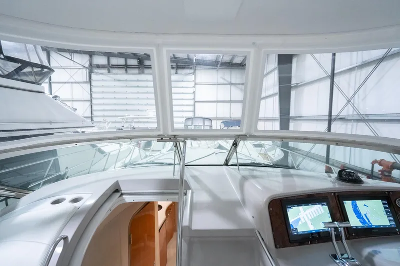 This Is Dope Yacht Photos Pics Interior view of a 2005 Formula 40 Cruiser yacht with navigation screens.