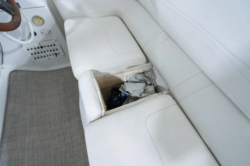 This Is Dope Yacht Photos Pics 2005 Formula 40 Cruiser interior with white seating and storage compartment.