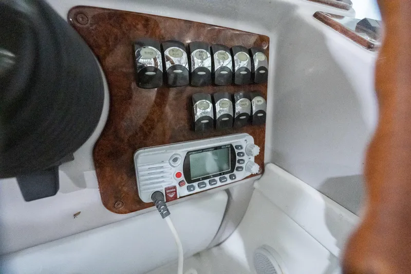 This Is Dope Yacht Photos Pics Control panel of a 2005 Formula 40 Cruiser with switches and a digital display.
