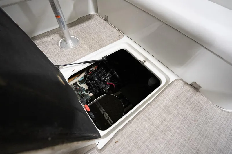 This Is Dope Yacht Photos Pics 2005 Formula 40 Cruiser engine compartment with open hatch, showcasing interior mechanics.