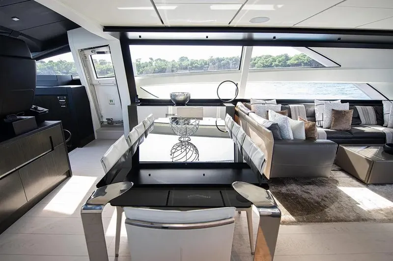  Yacht Photos Pics Luxurious interior of 2021 Pershing 9X yacht with modern dining and seating area.