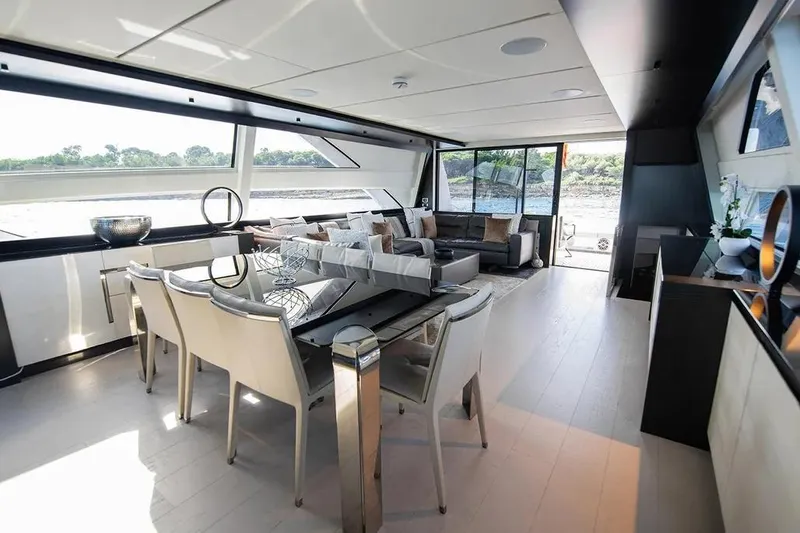  Yacht Photos Pics Luxurious interior of 2021 Pershing 9X yacht with modern dining and living area.