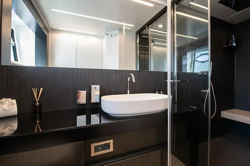  Yacht Photos Pics Luxurious bathroom interior of 2021 Pershing 9X yacht with modern fixtures and sleek design.