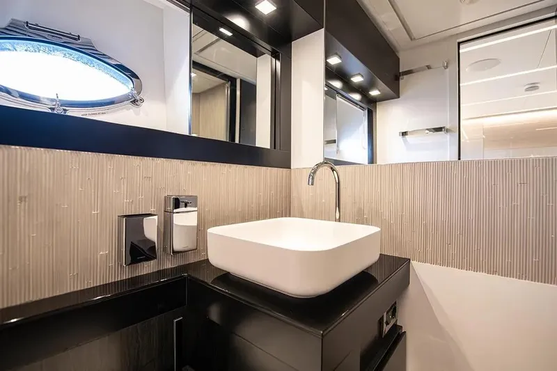  Yacht Photos Pics Luxurious bathroom interior of 2021 Pershing 9X yacht with modern sink and fixtures.