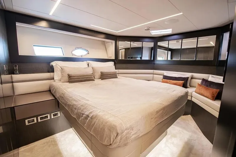  Yacht Photos Pics Luxurious bedroom interior of 2021 Pershing 9X yacht with modern design and plush bedding.