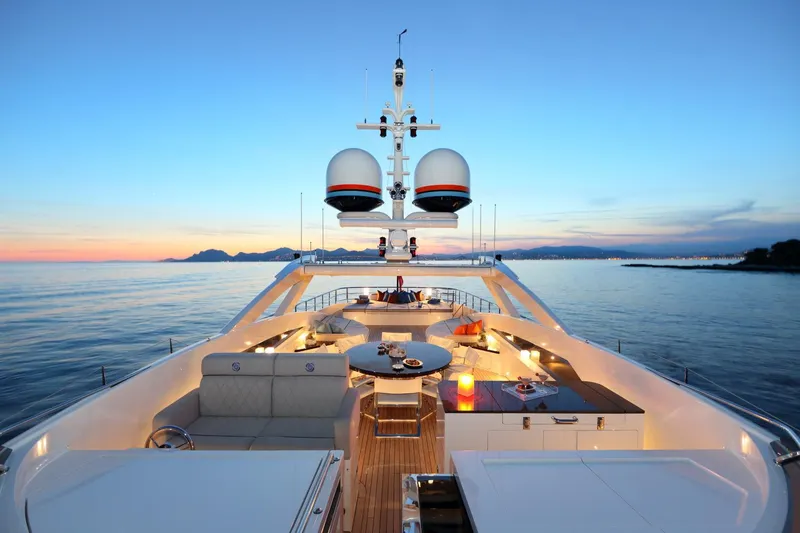 Aurelia Yacht Photos Pics Luxurious 2011 Heesen 3700 yacht deck at sunset with ocean view.