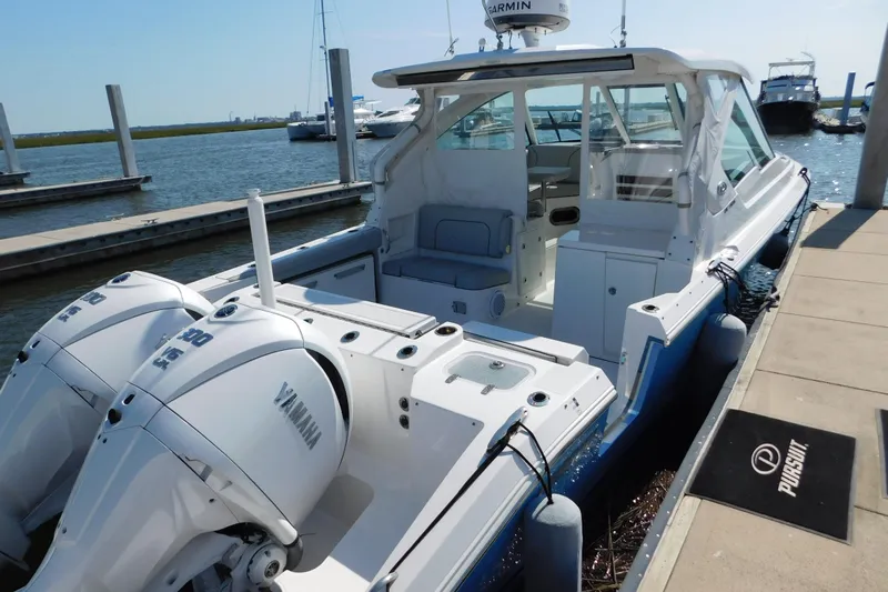  Yacht Photos Pics 2024 Pursuit DC 326 Dual Console boat docked with twin Yamaha engines.
