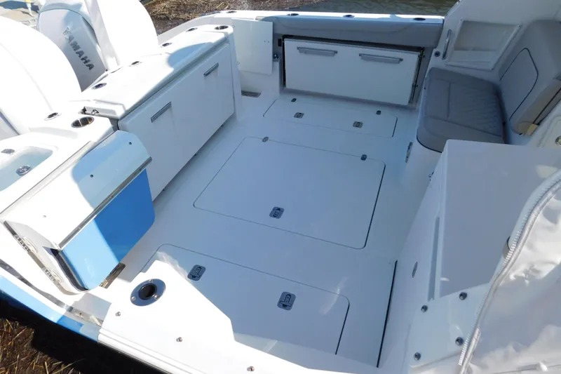  Yacht Photos Pics 2024 Pursuit DC 326 Dual Console boat interior with spacious deck and seating area.