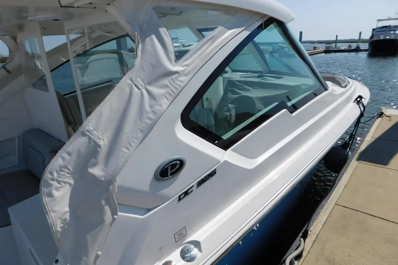  Yacht Photos Pics 2024 Pursuit DC 326 Dual Console boat docked at marina.