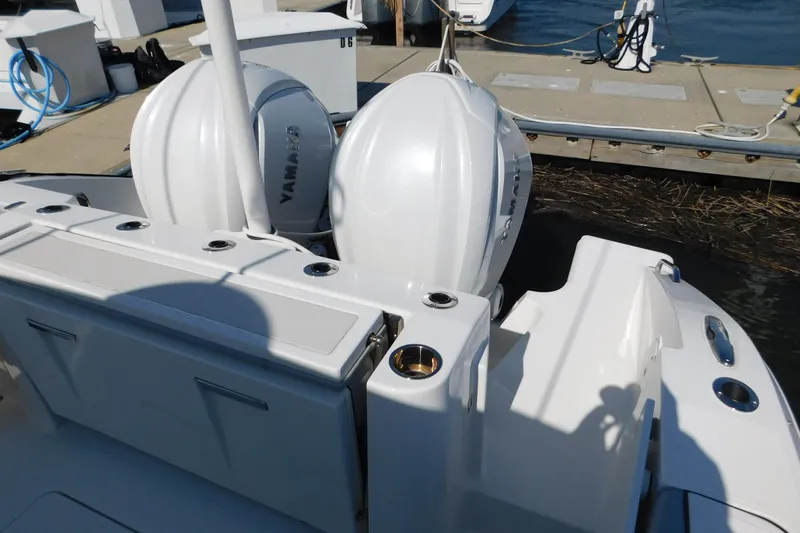  Yacht Photos Pics 2024 Pursuit DC 326 Dual Console boat with twin Yamaha outboard engines at dock.